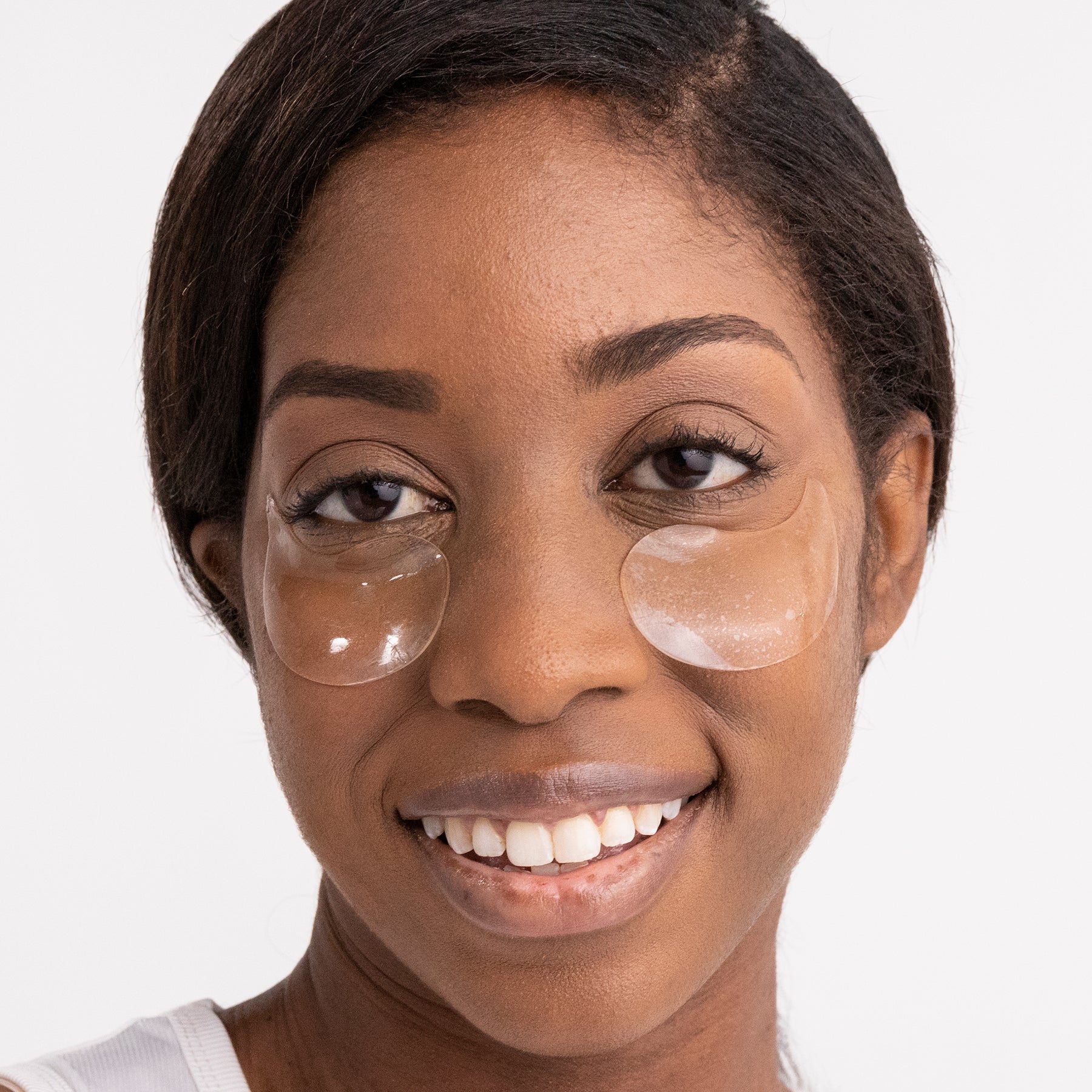A woman wearing the hydro-gel eye masks